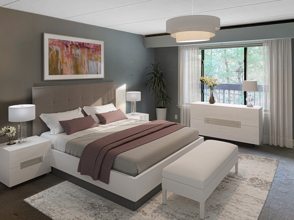 1500 Worcester Road, Unit 621 Framingham, MA 01702 - Photo 7 of 17 a bedroom with furniture and a large window