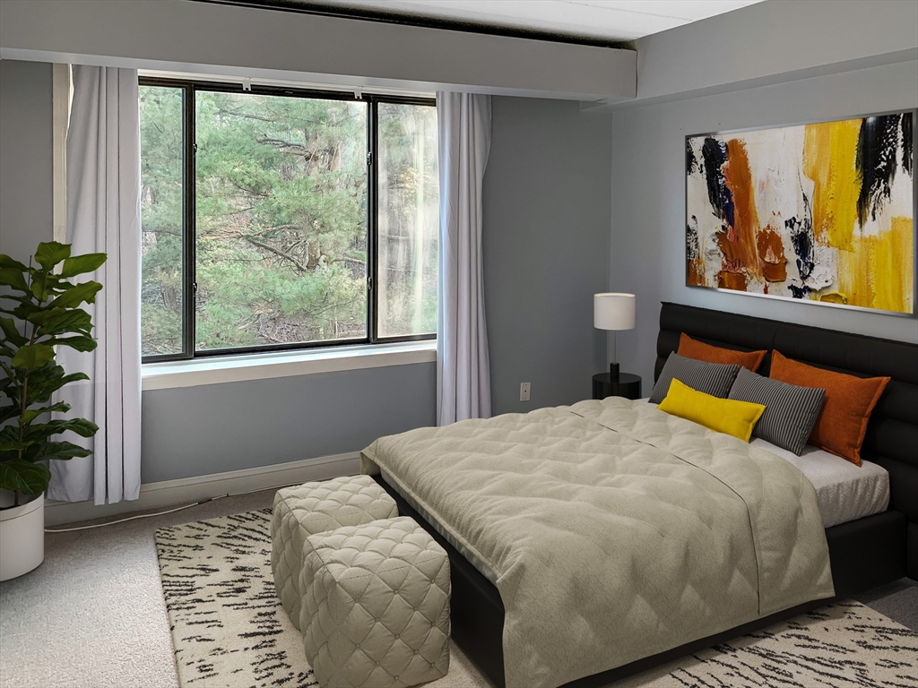 1500 Worcester Road, Unit 621 Framingham, MA 01702 - Photo 8 of 17 a bedroom with a bed and window
