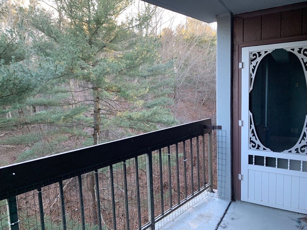1500 Worcester Road, Unit 621 Framingham, MA 01702 - Photo 10 of 17 a view of a balcony with washer and dryer