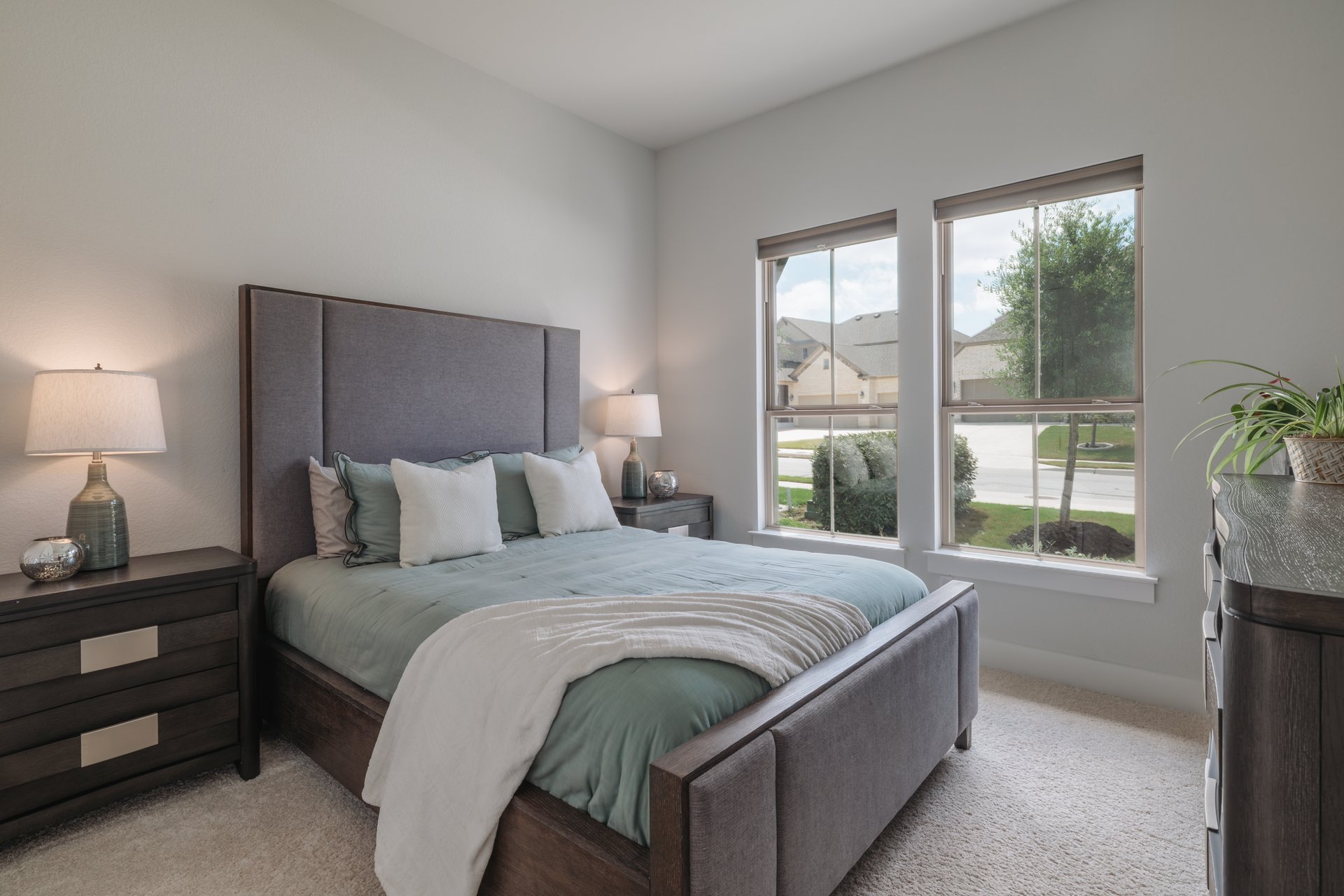 317 Autumn Oak Way Georgetown, TX 78628 - Photo 28 of 40 a bed sitting in a bedroom next to a window