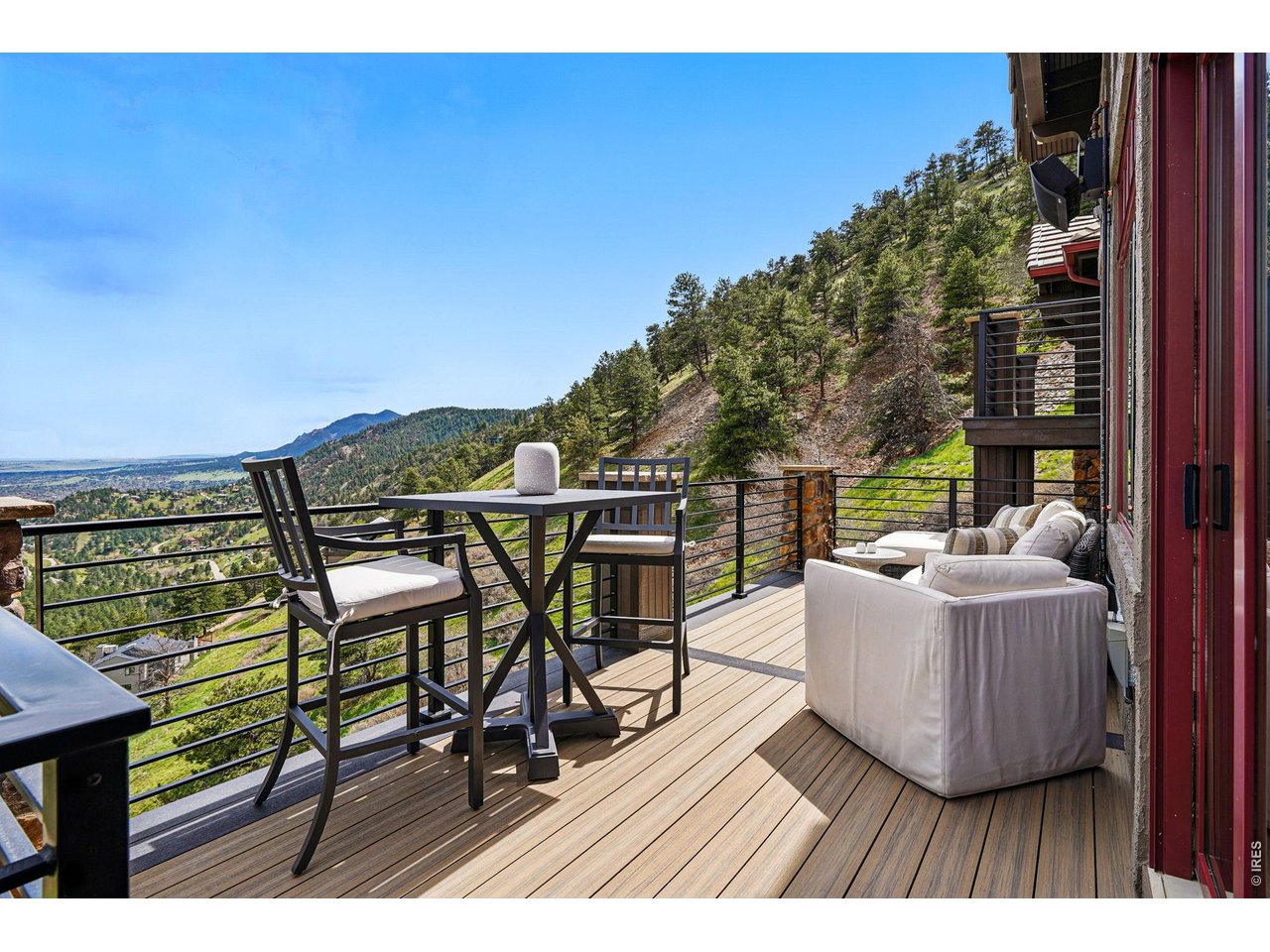 166 Valley View Way Boulder, CO 80304 - Photo 14 of 42 a view of a chairs and table in the balcony