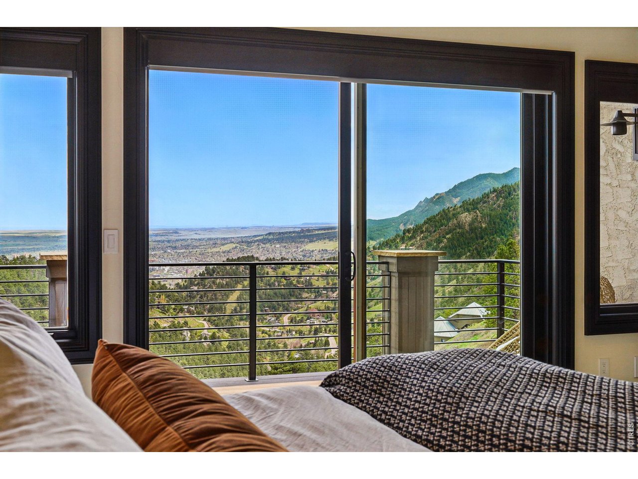 166 Valley View Way Boulder, CO 80304 - Photo 20 of 42 a bedroom with a bed and a large window
