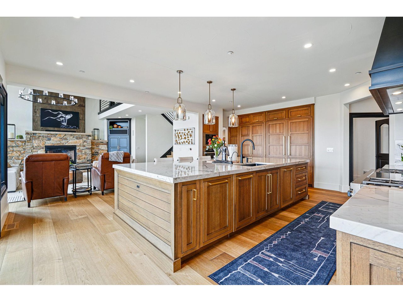 166 Valley View Way Boulder, CO 80304 - Photo 10 of 42 a large white kitchen with stainless steel appliances kitchen island granite countertop a large counter top and a stove top oven