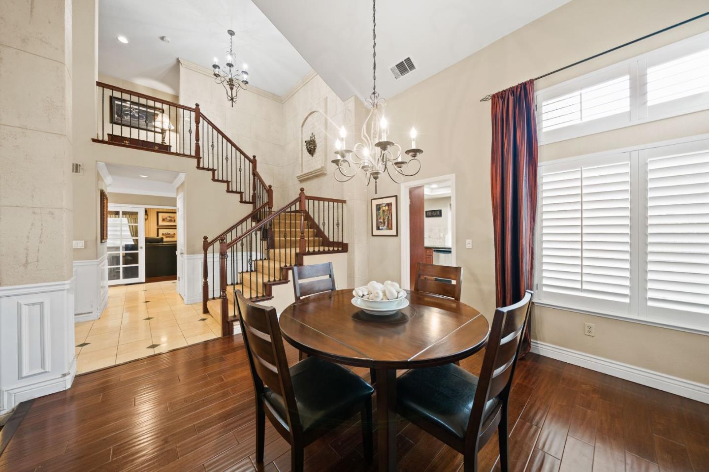1435 Eagle Street Tracy, CA 95376 - Photo 11 of 24 a view of a dining room with furniture a chandelier and wooden floor