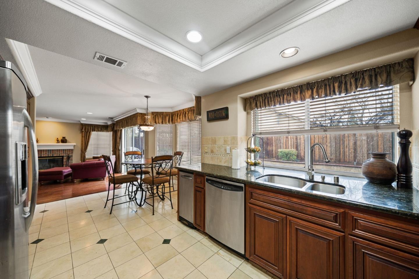 1435 Eagle Street Tracy, CA 95376 - Photo 14 of 24 a kitchen with granite countertop sink and cabinets