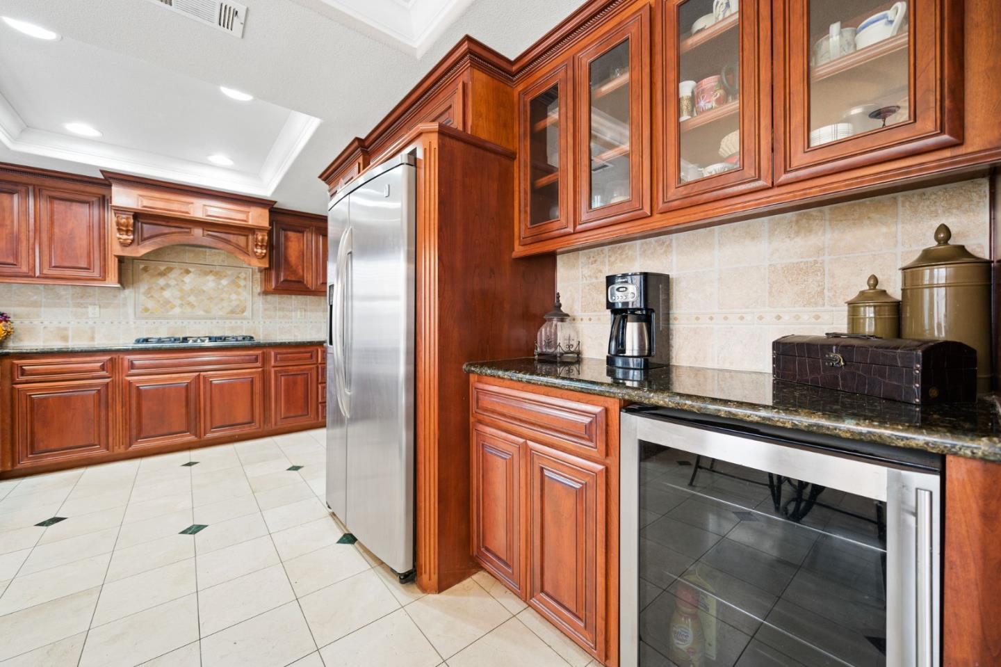 1435 Eagle Street Tracy, CA 95376 - Photo 15 of 24 a kitchen with stainless steel appliances granite countertop a refrigerator and a sink