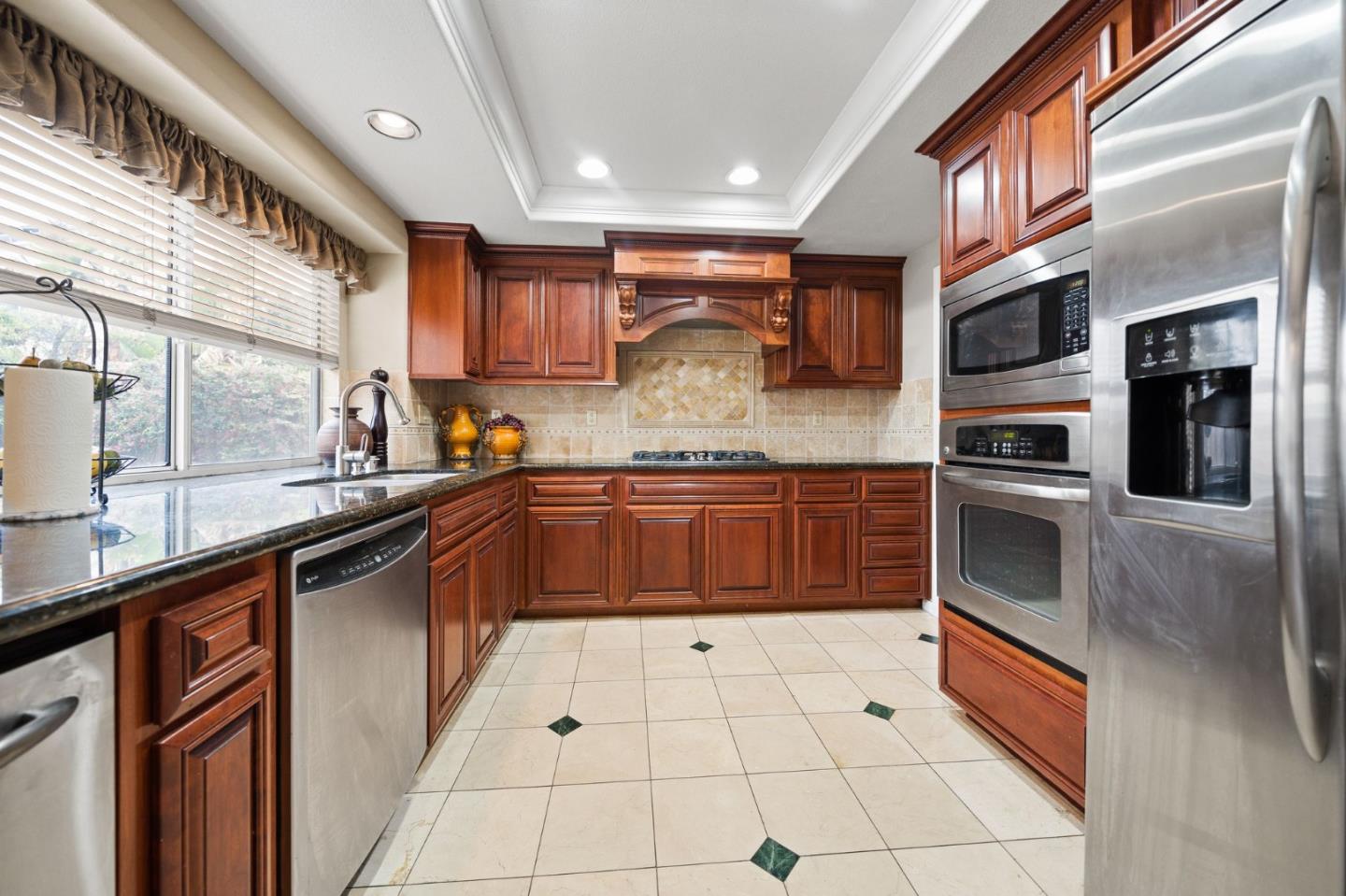 1435 Eagle Street Tracy, CA 95376 - Photo 16 of 24 a kitchen with stainless steel appliances and cabinets