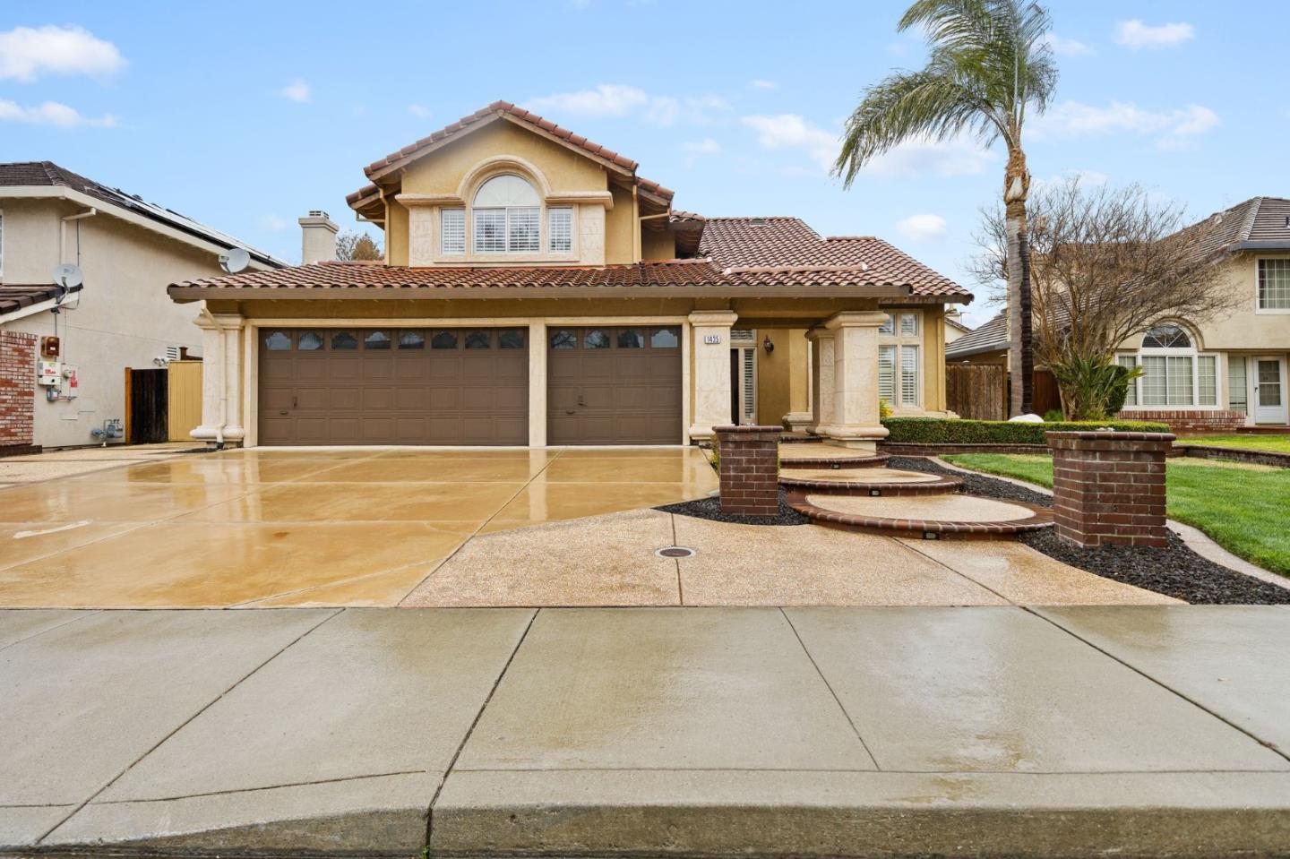 1435 Eagle Street Tracy, CA 95376 - Photo 2 of 24 a front view of a house with a garden
