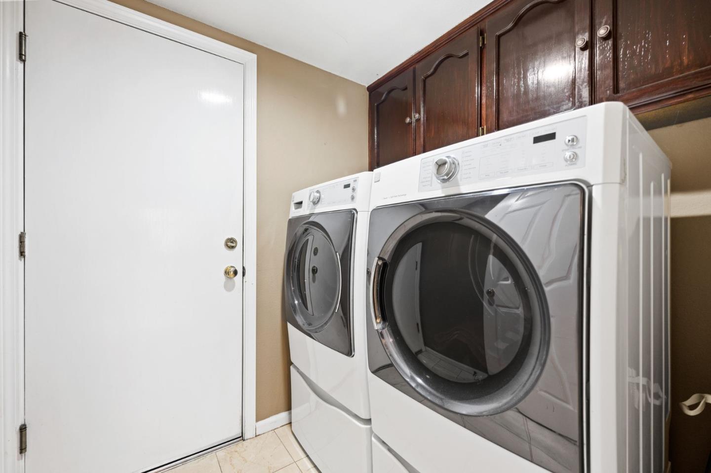 1435 Eagle Street Tracy, CA 95376 - Photo 21 of 24 a view of a hallway with washer and dryer
