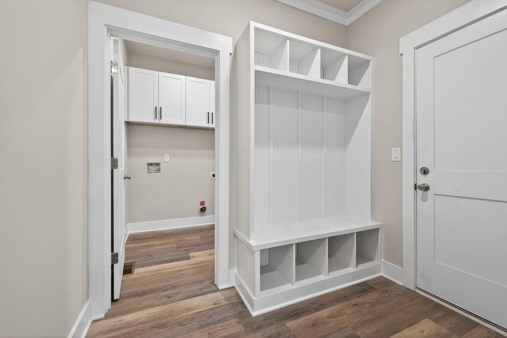 4947 Old Orr Road Flowery Branch, GA 30542 - Photo 21 of 60 a view of an empty walk in closet with wooden floor and a window