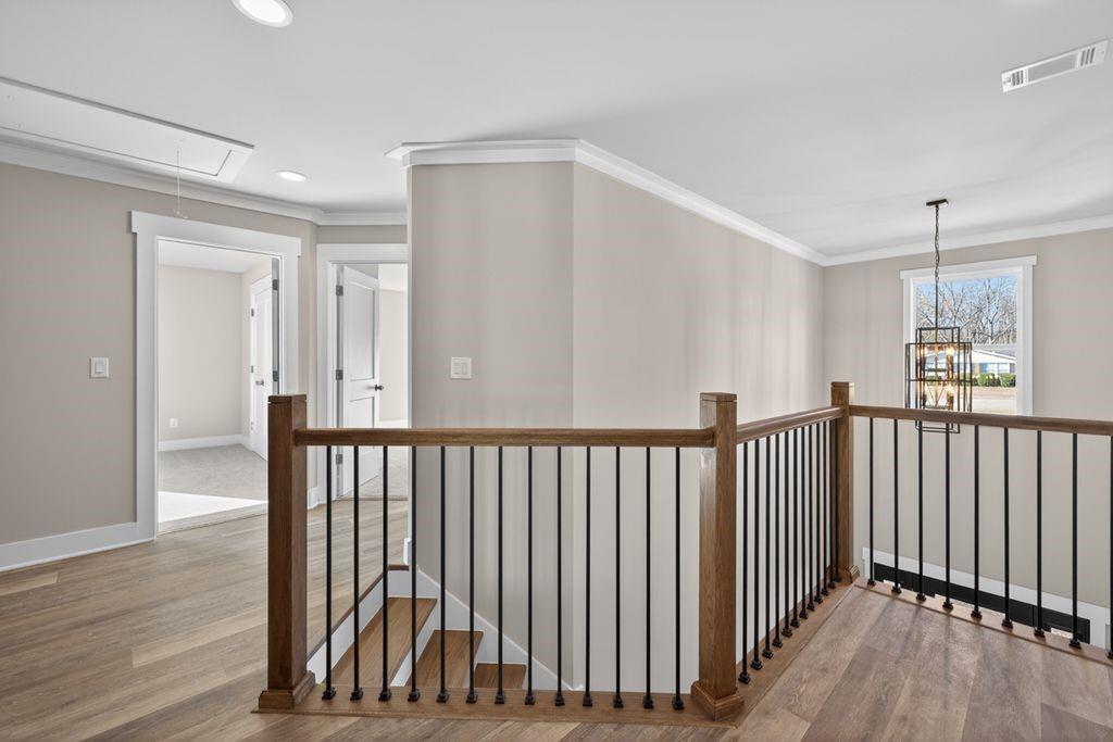 4947 Old Orr Road Flowery Branch, GA 30542 - Photo 27 of 60 a view of a hallway with wooden floor and windows