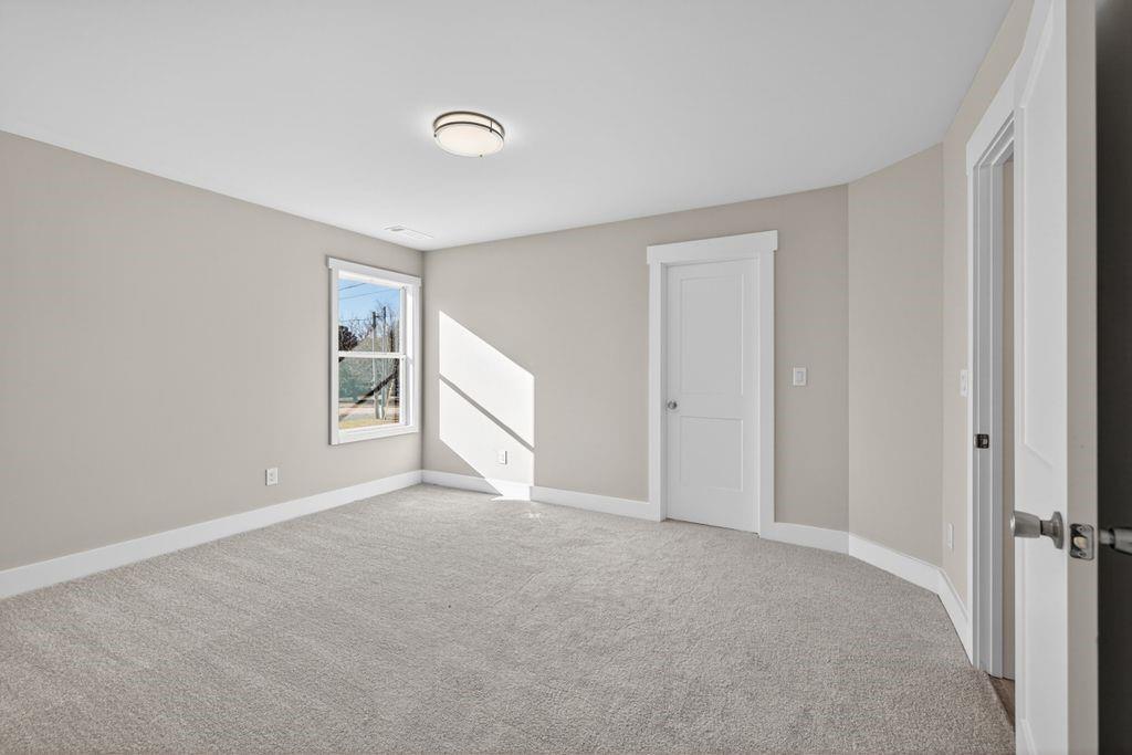 4947 Old Orr Road Flowery Branch, GA 30542 - Photo 33 of 60 a view of an empty room with window and closet area