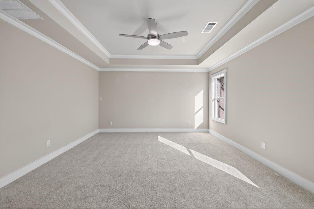 4947 Old Orr Road Flowery Branch, GA 30542 - Photo 40 of 60 an empty room with a ceiling fan and window