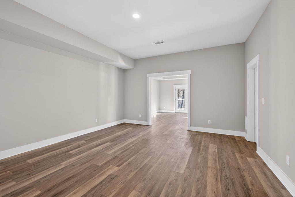 4947 Old Orr Road Flowery Branch, GA 30542 - Photo 50 of 60 a view of an empty room and wooden floor
