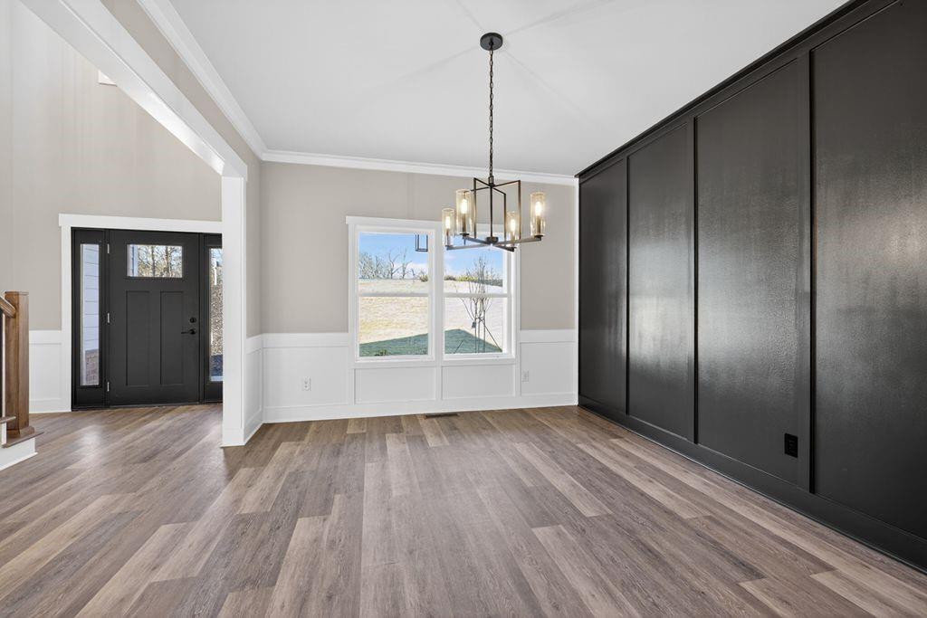 4947 Old Orr Road Flowery Branch, GA 30542 - Photo 7 of 60 a view of a room with wooden floor cabinetry and windows