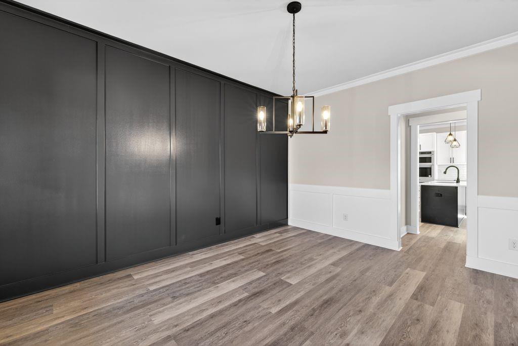 4947 Old Orr Road Flowery Branch, GA 30542 - Photo 8 of 60 a view of empty room with wooden floor