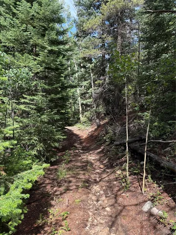 a view of a house with a yard and balcony