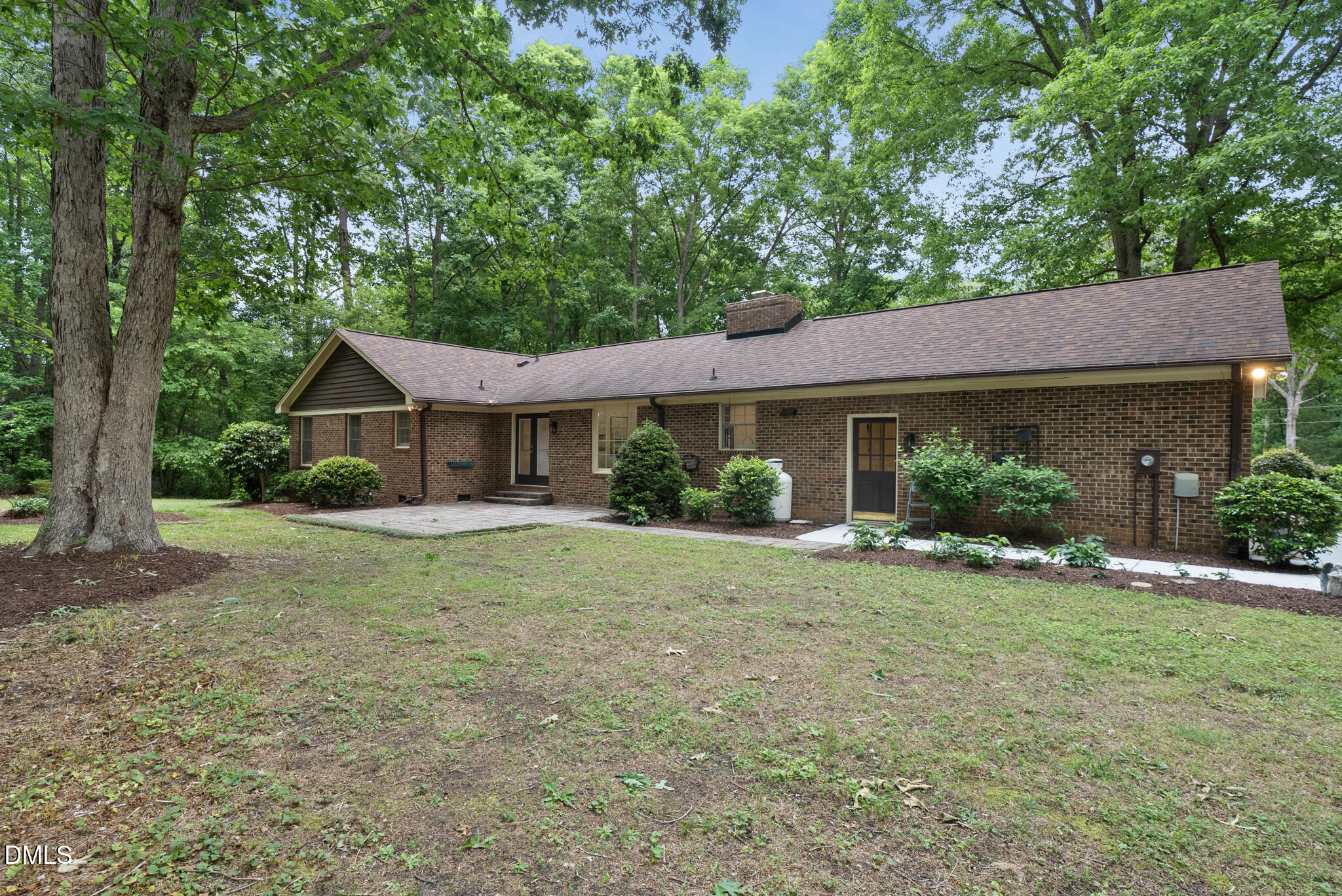 3404 Timberwood Court Raleigh, NC 27606 - Photo 31 of 45 a front view of a house with a yard and green space