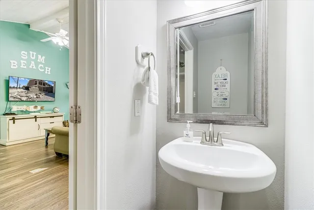 a bathroom with a sink and a mirror