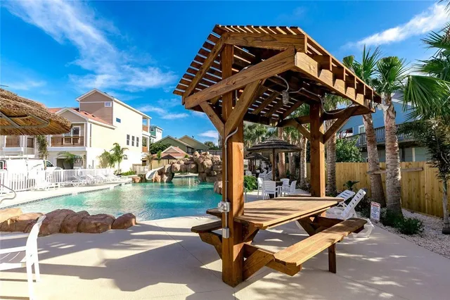 a view of a swimming pool with a patio