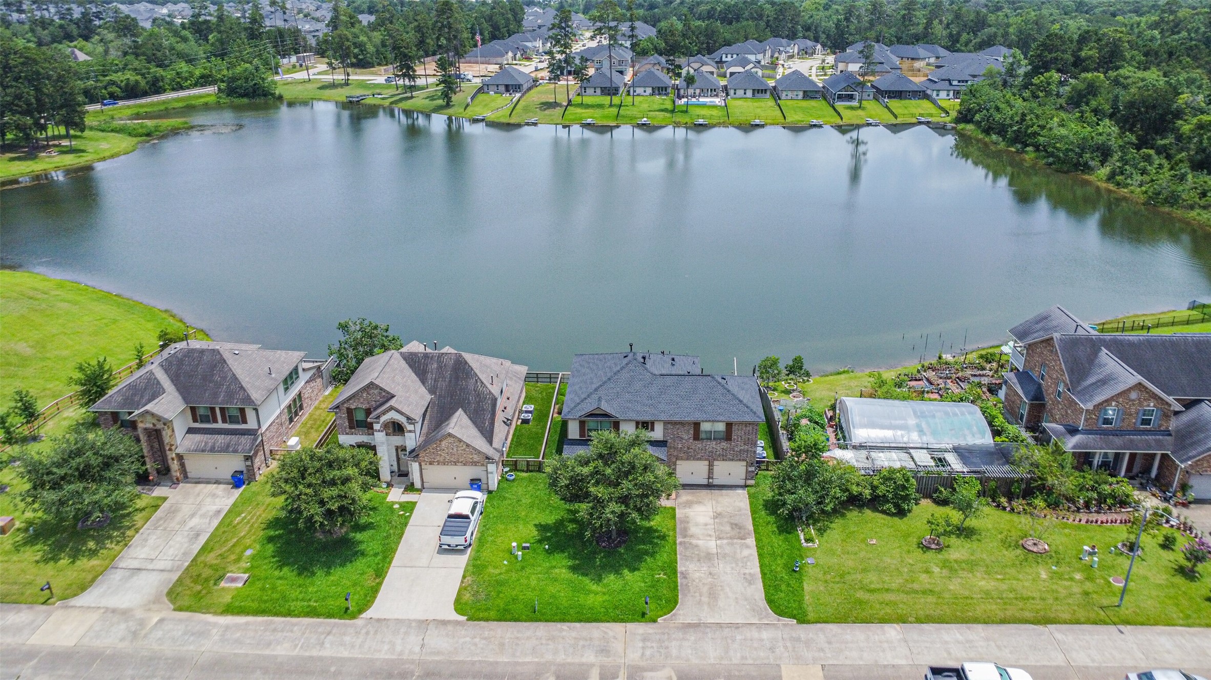 12009 La Salle River Road Conroe, TX 77304 - Photo 39 of 50 an aerial view of a house with a lake view