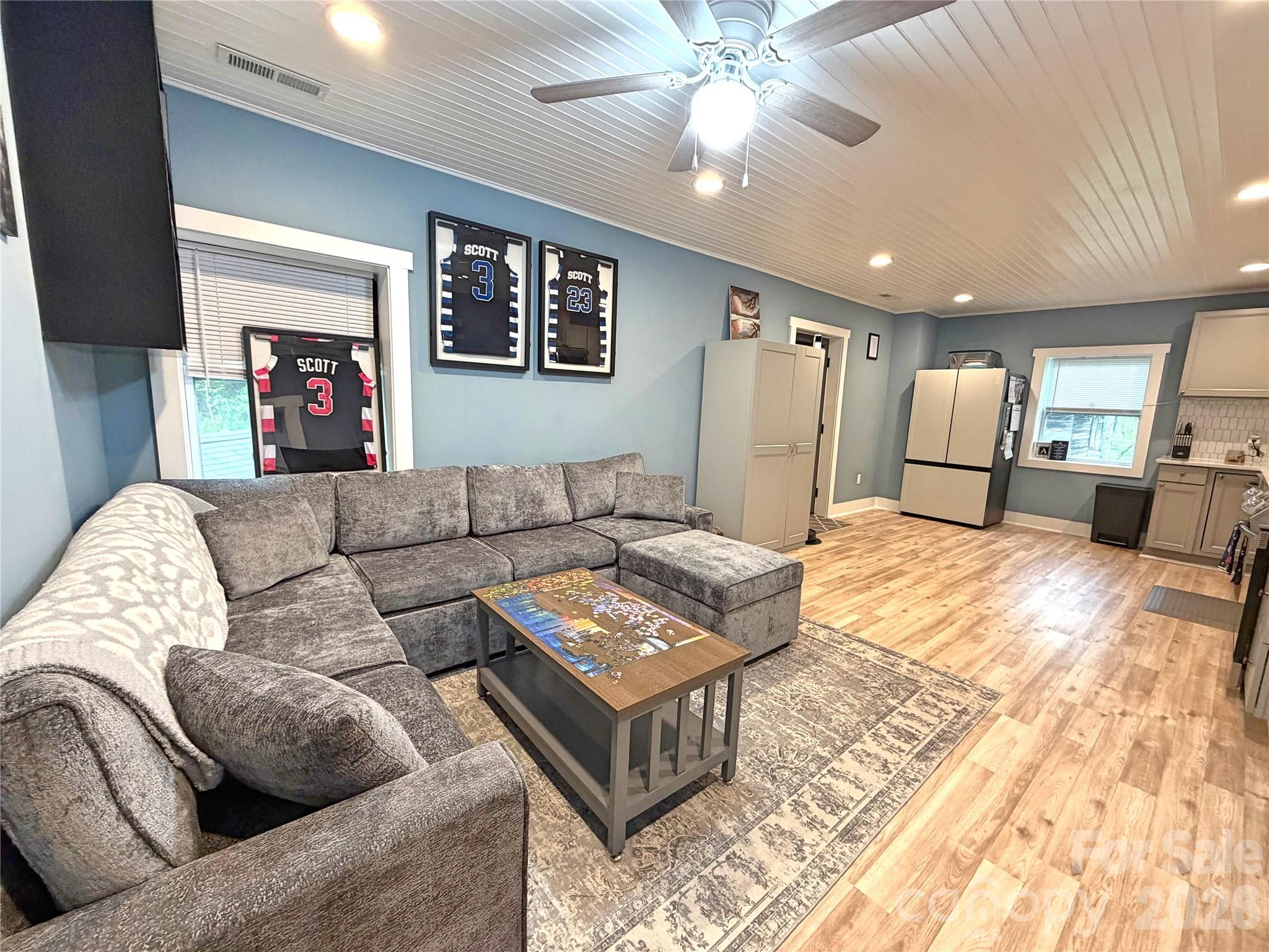 153 Arrowood Corner Road Mars Hill, NC 28754 - Photo 13 of 34 a living room with furniture and a ceiling fan