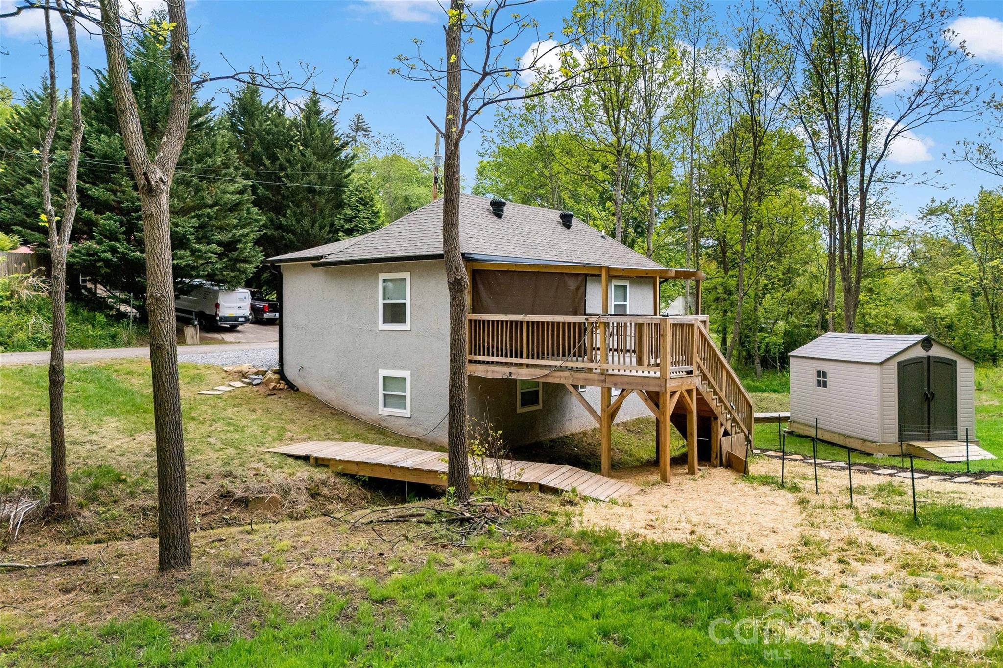 153 Arrowood Corner Road Mars Hill, NC 28754 - Photo 2 of 34 a view of a house with backyard and a tree