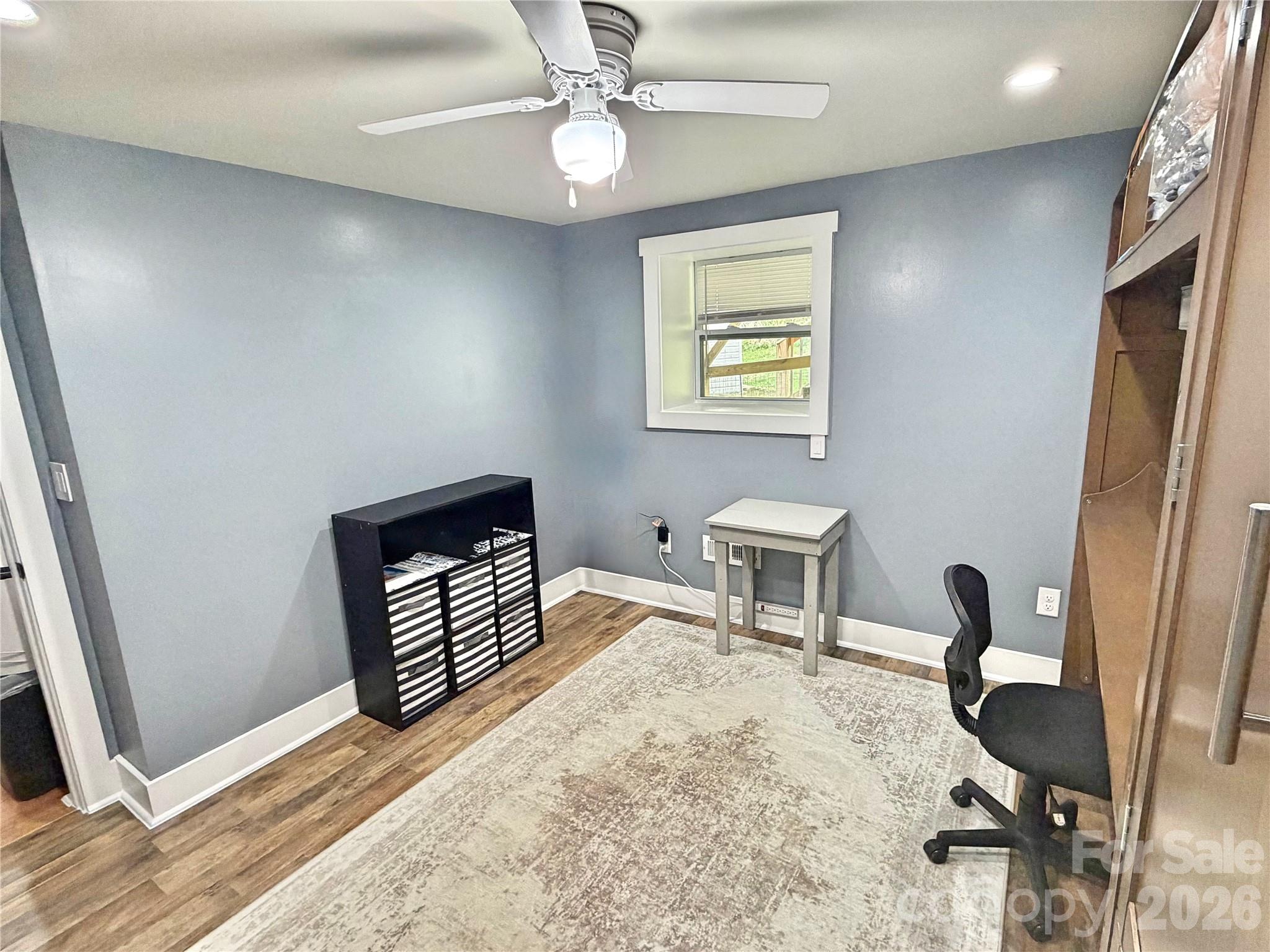 153 Arrowood Corner Road Mars Hill, NC 28754 - Photo 22 of 34 a bedroom with furniture and a window