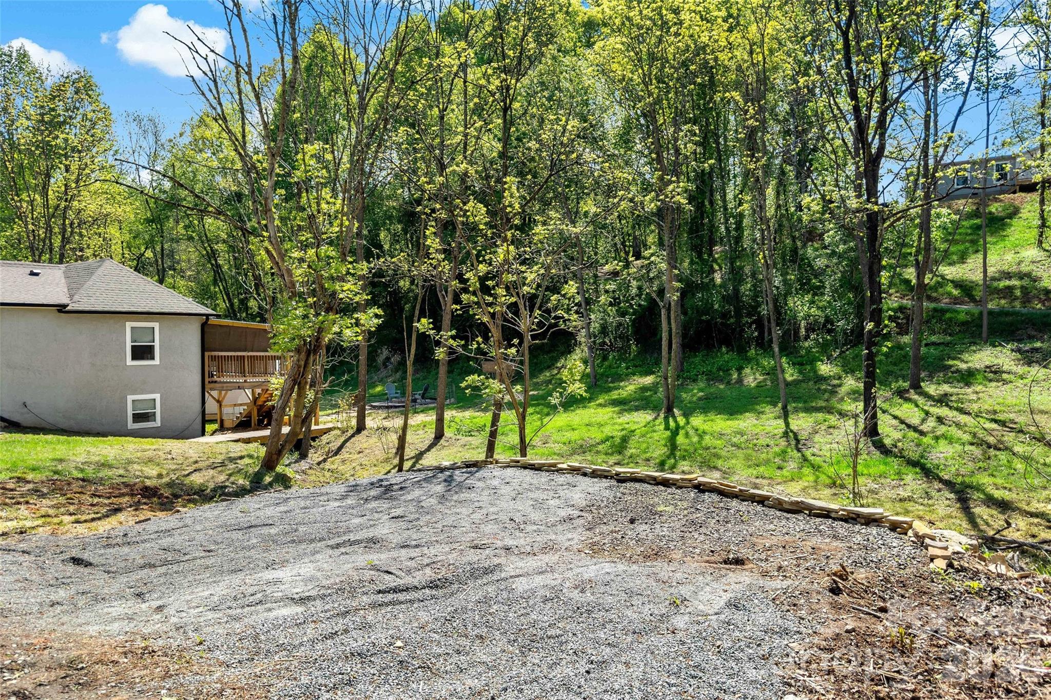 153 Arrowood Corner Road Mars Hill, NC 28754 - Photo 32 of 34 a view of house with a backyard and trees