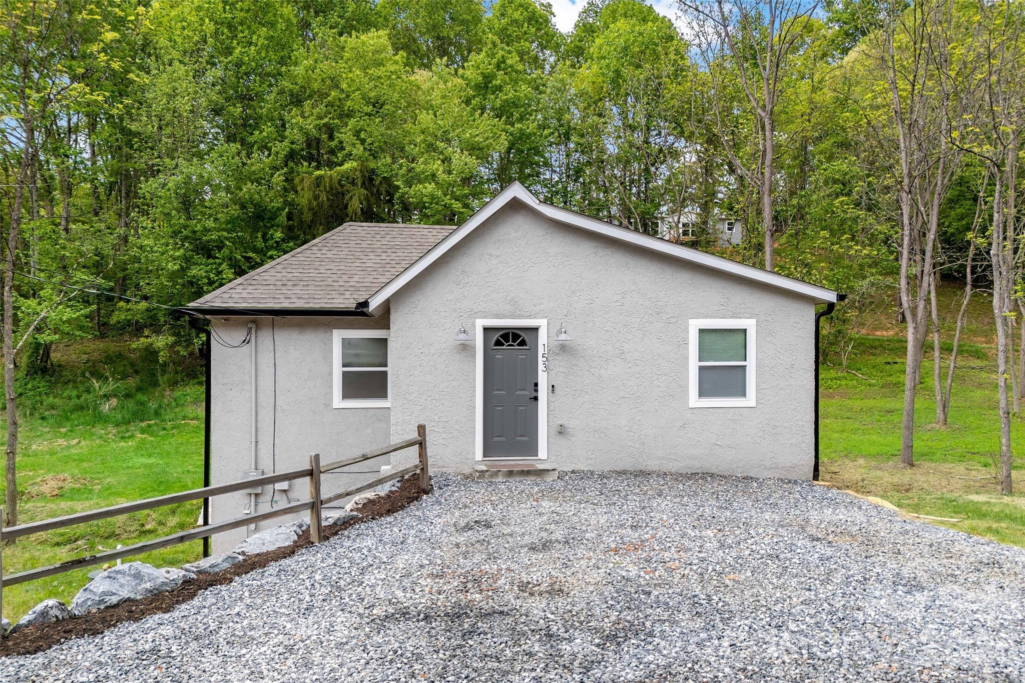 153 Arrowood Corner Road Mars Hill, NC 28754 - Photo 4 of 34 a view of a house with a yard