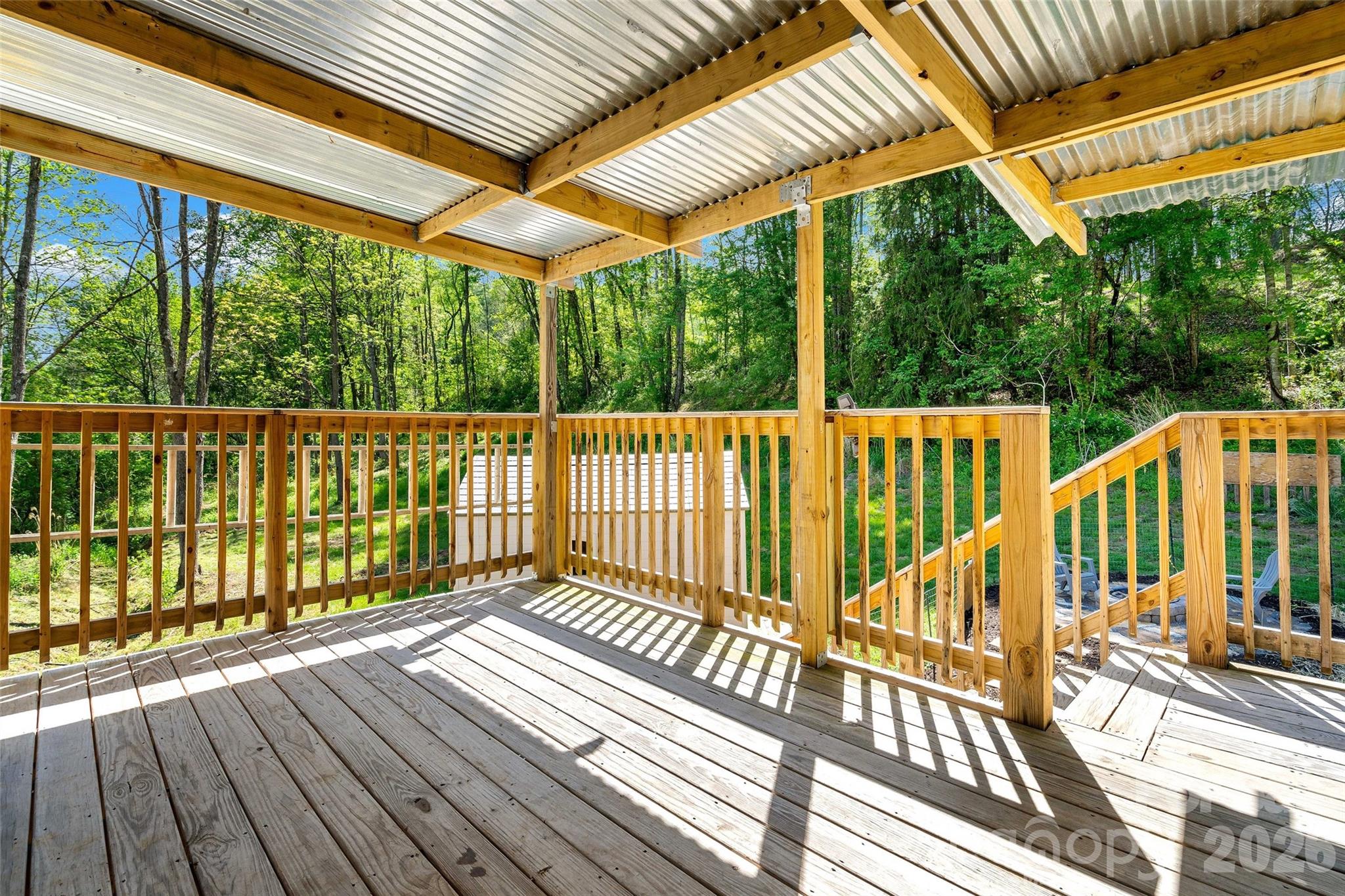 153 Arrowood Corner Road Mars Hill, NC 28754 - Photo 6 of 34 a view of a wooden deck