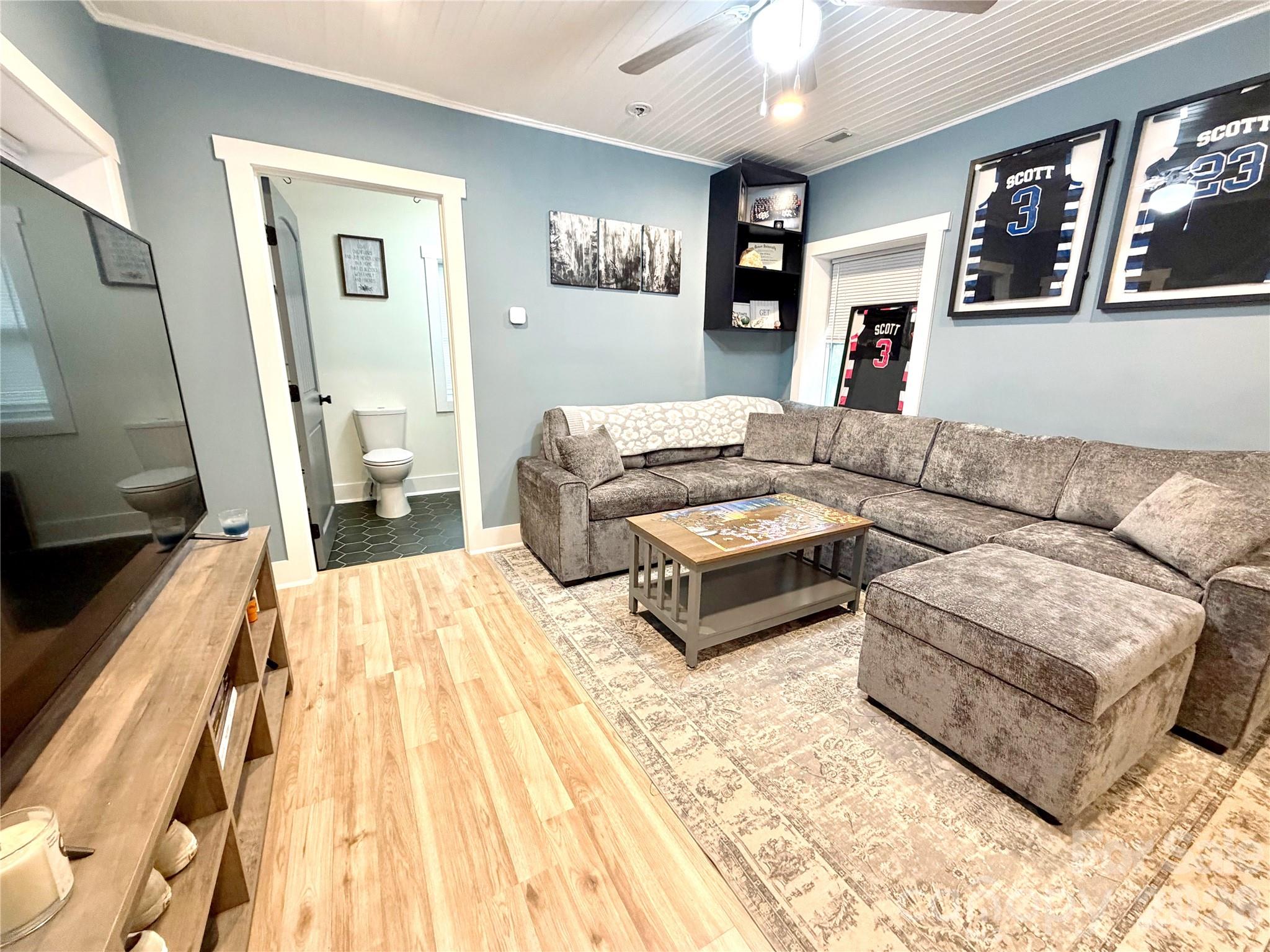 153 Arrowood Corner Road Mars Hill, NC 28754 - Photo 10 of 34 a living room with furniture and a flat screen tv