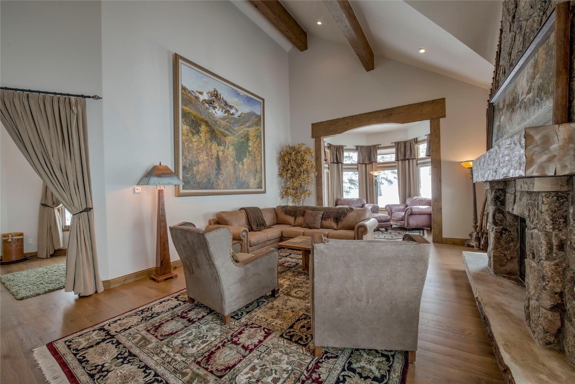 68 Snowy Ridge Road Breckenridge, CO 80424 - Photo 8 of 42 a living room with furniture and a fireplace
