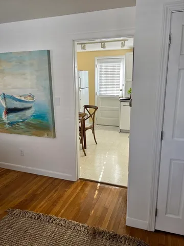 a view of a livingroom with furniture and wooden floor