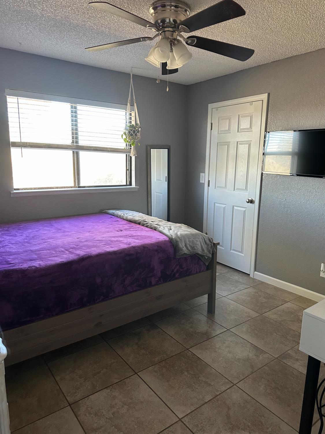 46725 Picayune Creek Road Coarsegold, CA 93614 - Photo 21 of 49 a bedroom with a bed and a window