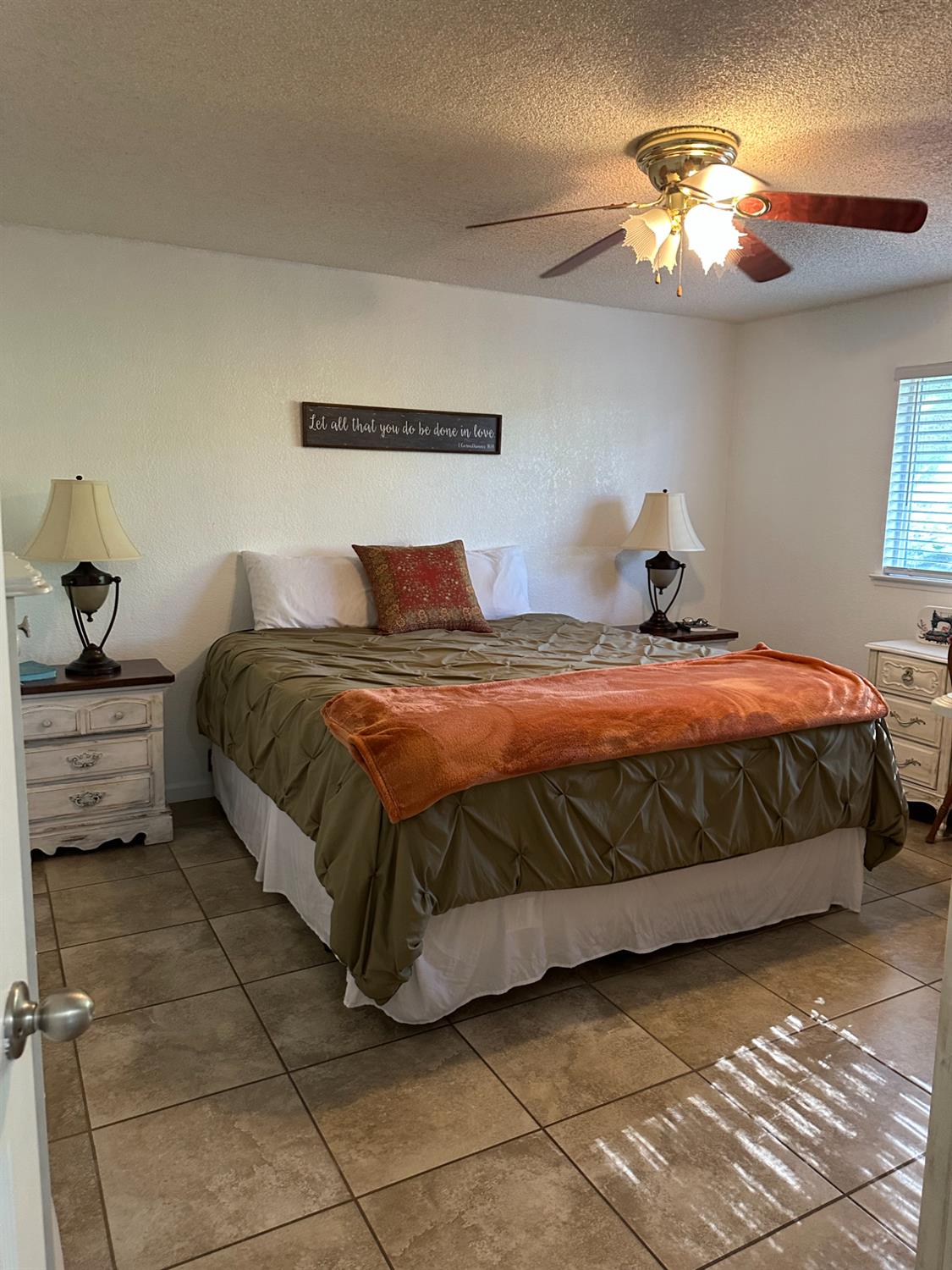 46725 Picayune Creek Road Coarsegold, CA 93614 - Photo 24 of 49 a bedroom with a bed and a chandelier