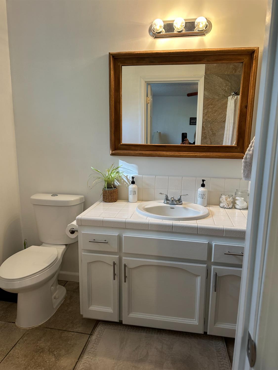 46725 Picayune Creek Road Coarsegold, CA 93614 - Photo 25 of 49 a bathroom with a toilet sink and mirror