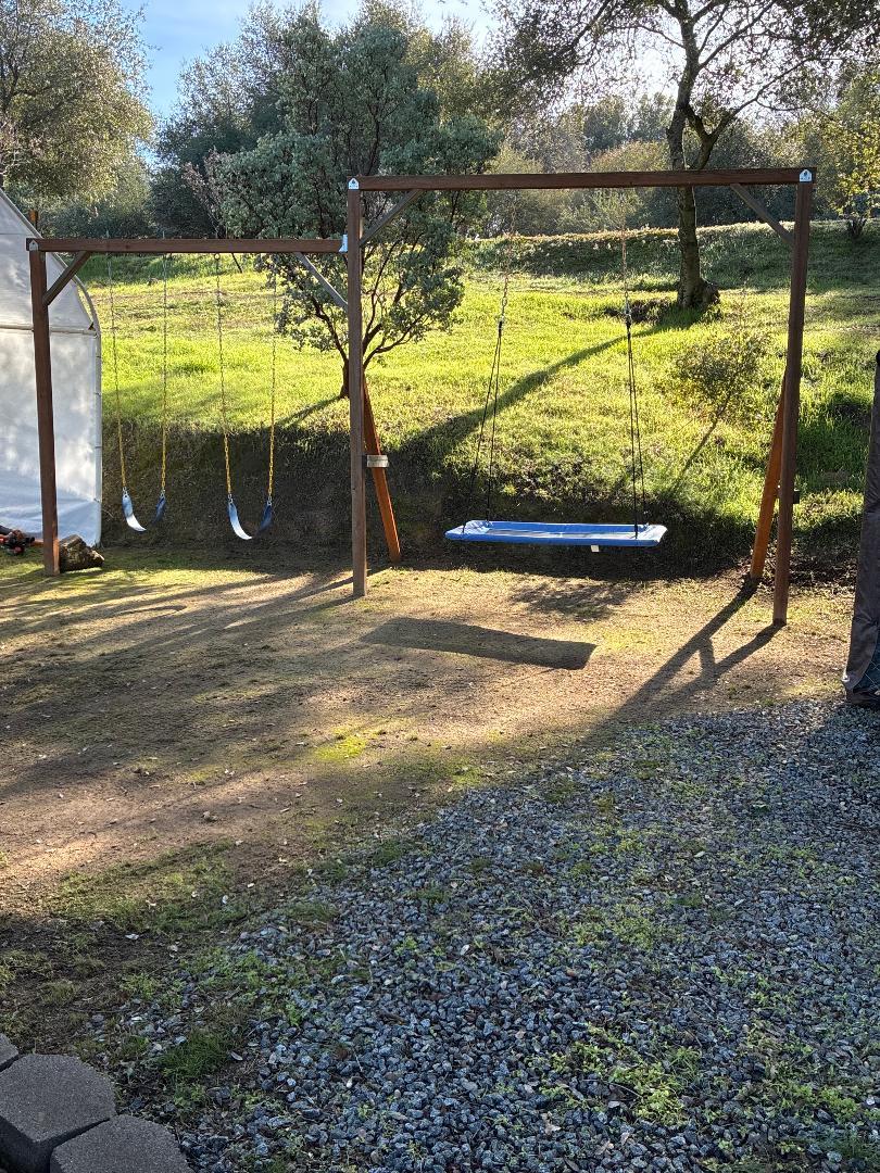 46725 Picayune Creek Road Coarsegold, CA 93614 - Photo 26 of 49 a view of a swimming pool with a patio and a yard