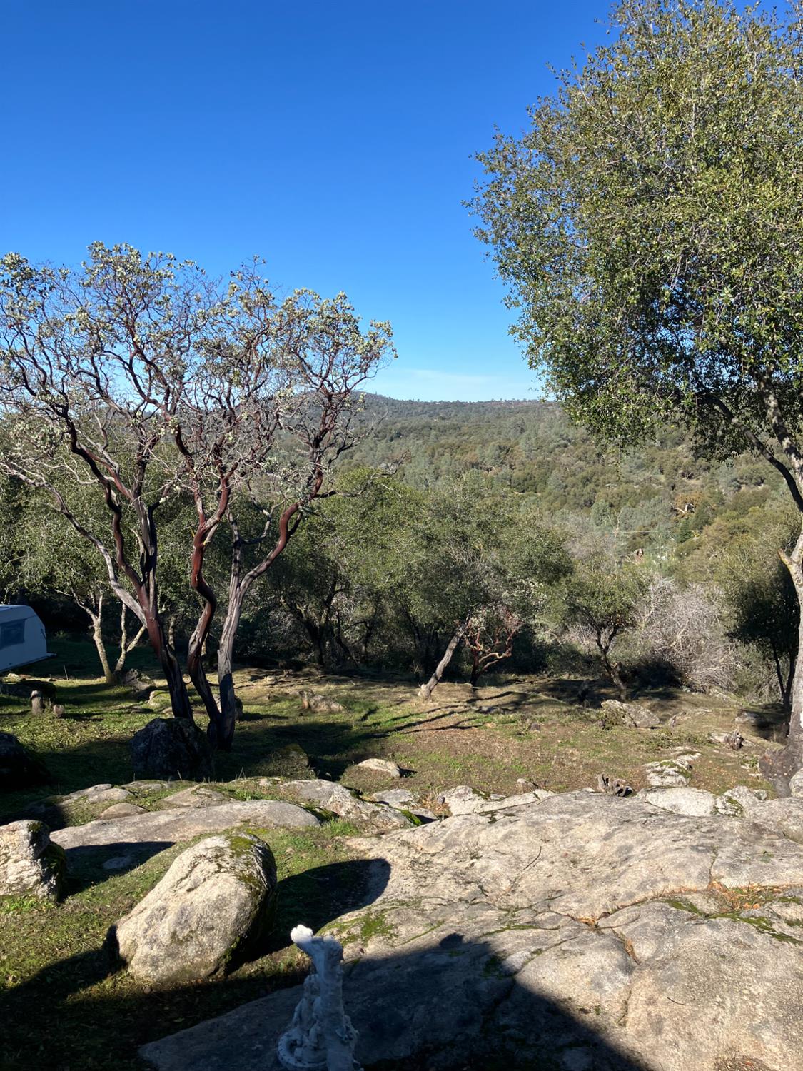46725 Picayune Creek Road Coarsegold, CA 93614 - Photo 45 of 49 a view of a lake with lawn chairs