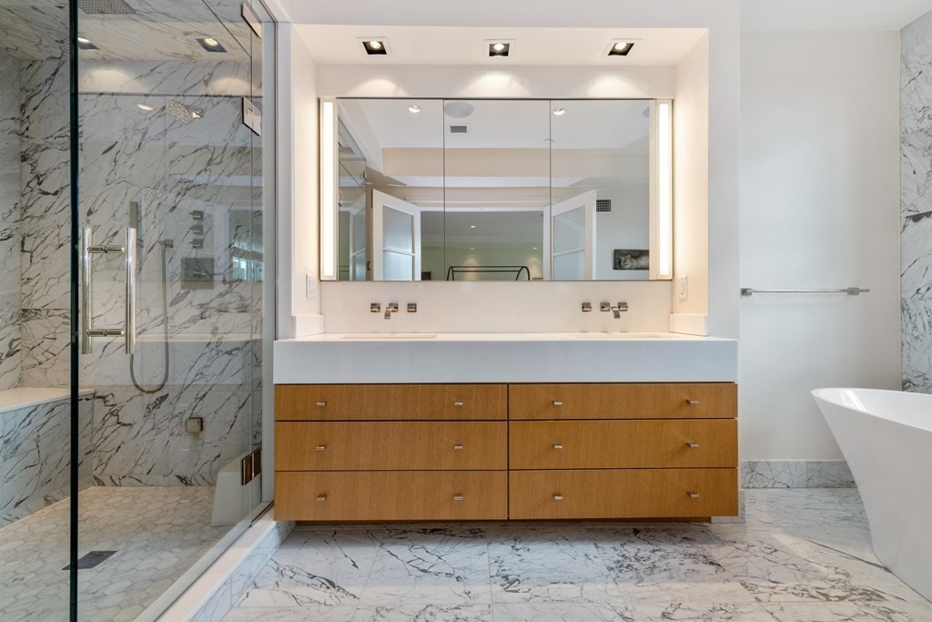 28 Mt Vernon Street, Unit 2 Boston, MA 02108 - Photo 12 of 31 a bathroom with a double vanity sink mirror and shower