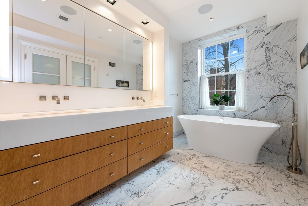 28 Mt Vernon Street, Unit 2 Boston, MA 02108 - Photo 13 of 31 a bathroom with a bathtub sink and mirror