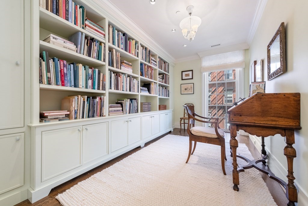 28 Mt Vernon Street, Unit 2 Boston, MA 02108 - Photo 16 of 31 a workspace with furniture and a book shelf