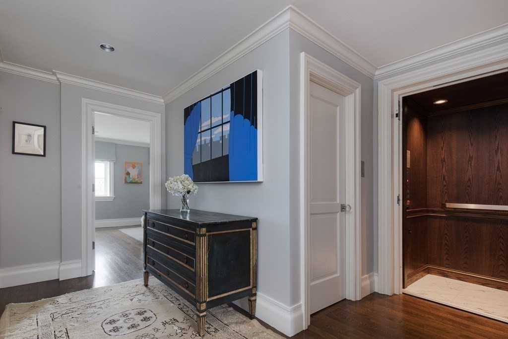 28 Mt Vernon Street, Unit 2 Boston, MA 02108 - Photo 19 of 31 a hallway with front door wooden floor and windows