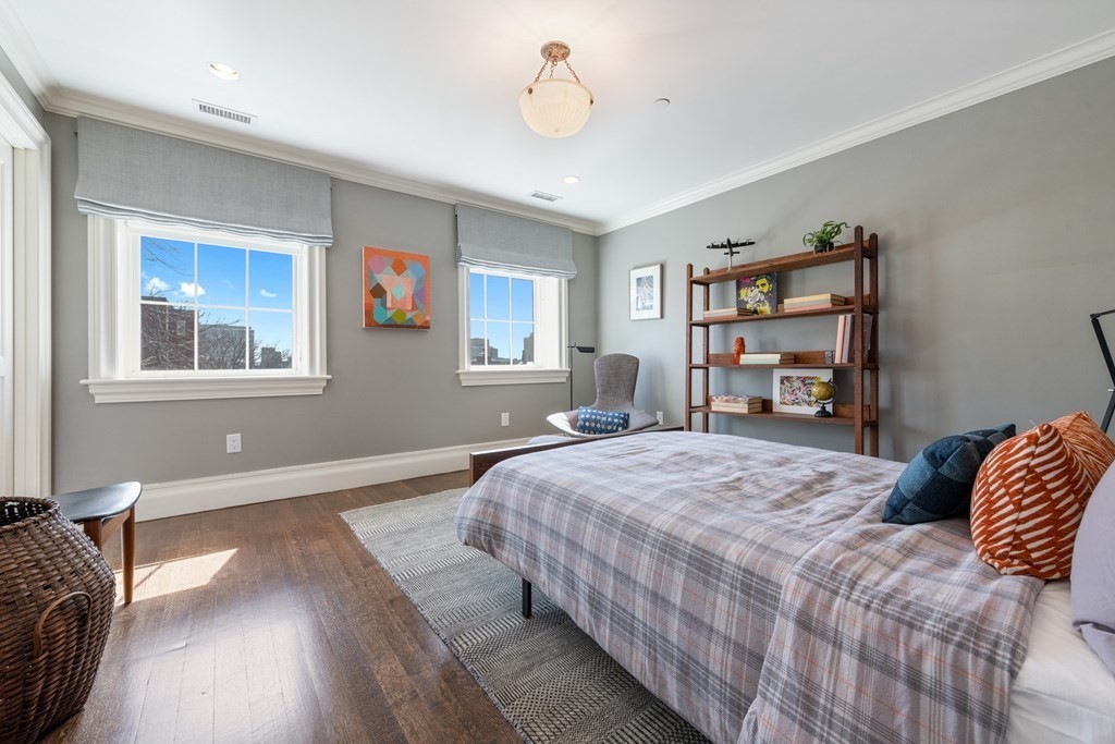 28 Mt Vernon Street, Unit 2 Boston, MA 02108 - Photo 20 of 31 a bedroom with a bed and wooden floor