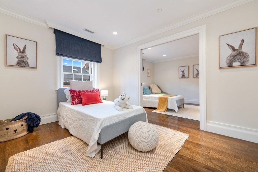 28 Mt Vernon Street, Unit 2 Boston, MA 02108 - Photo 22 of 31 a bedroom with a bed and wooden floor