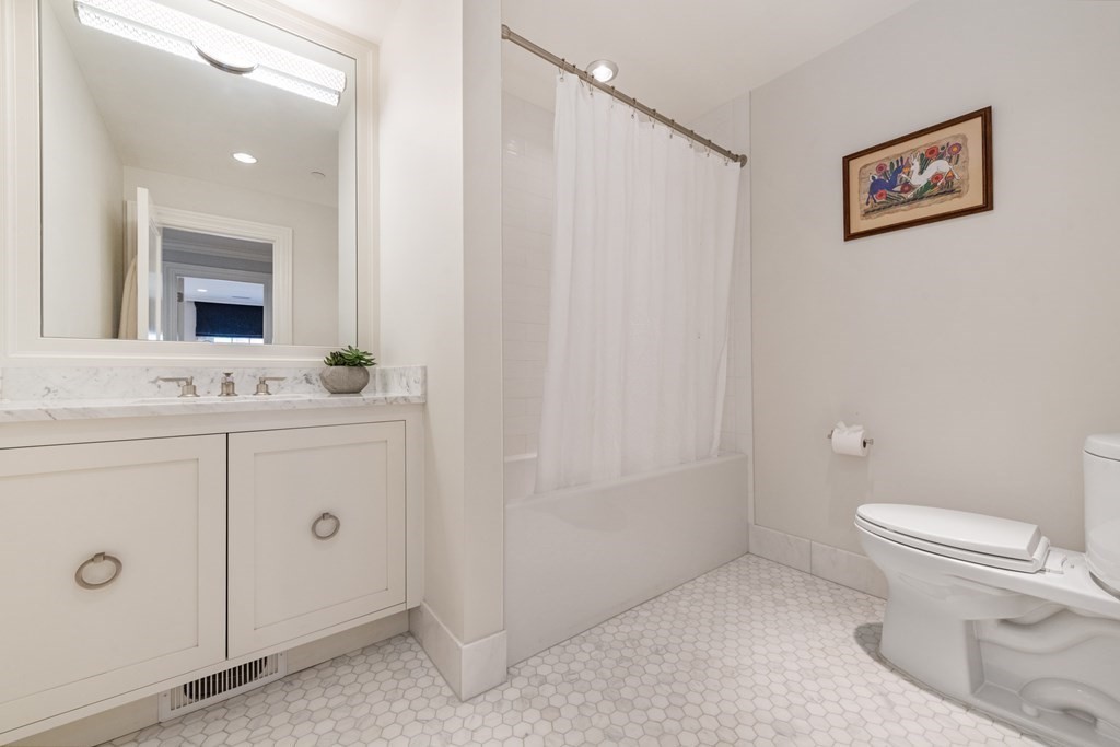 28 Mt Vernon Street, Unit 2 Boston, MA 02108 - Photo 24 of 31 a bathroom with a toilet sink vanity and mirror