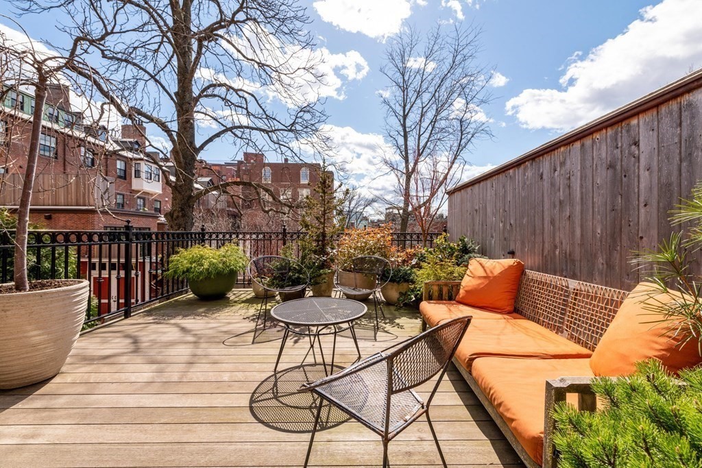 28 Mt Vernon Street, Unit 2 Boston, MA 02108 - Photo 5 of 31 a view of a patio with couches table and chairs and potted plants
