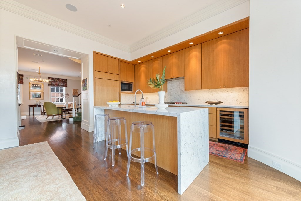 28 Mt Vernon Street, Unit 2 Boston, MA 02108 - Photo 6 of 31 a kitchen with kitchen island granite countertop a stove refrigerator and cabinets