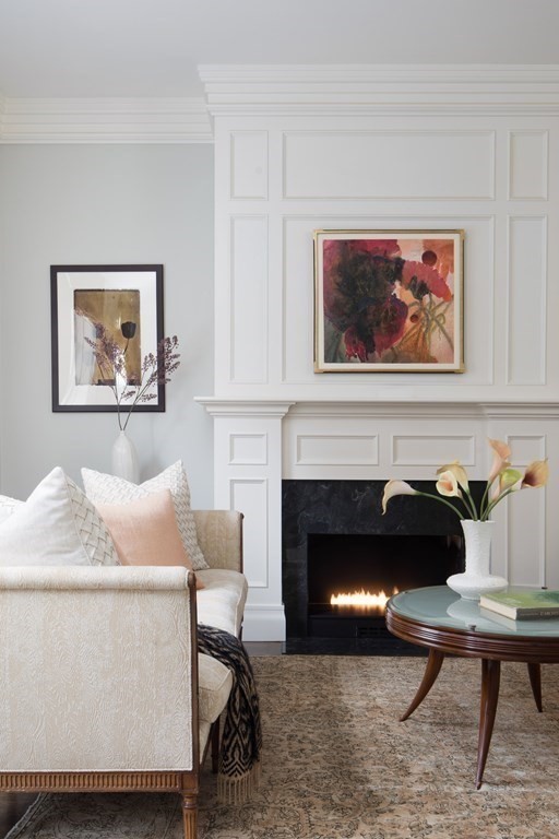 28 Mt Vernon Street, Unit 2 Boston, MA 02108 - Photo 9 of 31 a living room with furniture a fireplace and wall paintings