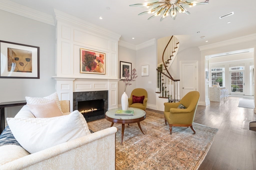 28 Mt Vernon Street, Unit 2 Boston, MA 02108 - Photo 10 of 31 a living room with furniture and a fireplace